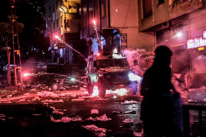 Millitants lobb fireworks towards an armoured police vehicle during clashes with Turkish police, on August 27, 2015 in the Gazi district in Istanbul. Five people, including two children and a soldier, were killed in clashes between Kurdish militants and security forces in Turkey's restive Kurdish-majority southeast on August 27, local officials and the army said. Millitants lobb fireworks towards an armoured police vehicle during clashes with Turkish police, on August 27, 2015 in the Gazi district in Istanbul. Five people, including two children and a soldier, were killed in clashes between Kurdish militants and security forces in Turkey's restive Kurdish-majority southeast on August 27, local officials and the army said.