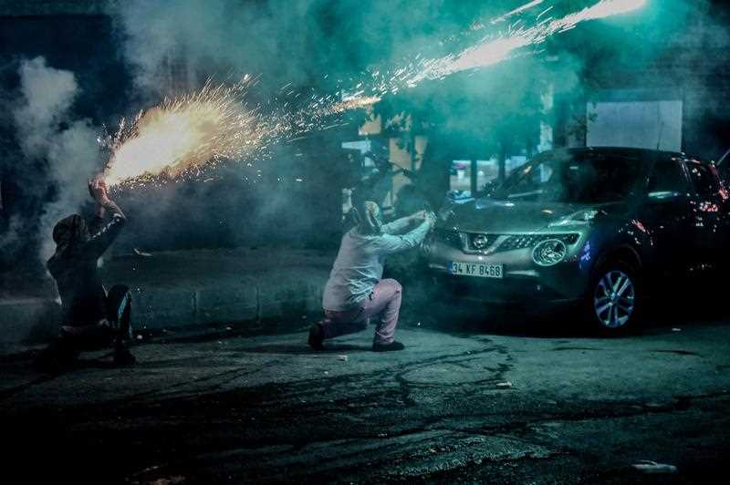 Masked kurdish millitants fire fireworks towards Turkish police during clashes during clashes on August 27,2015 in the Gazi district of Istanbul. Five people, including two children and a soldier, were killed in clashes between Kurdish militants and security forces in Turkey's restive Kurdish-majority southeast on August 27, 2015, local officials and the army said. Masked kurdish millitants fire fireworks towards Turkish police during clashes during clashes on August 27,2015 in the Gazi district of Istanbul. Five people, including two children and a soldier, were killed in clashes between Kurdish militants and security forces in Turkey's restive Kurdish-majority southeast on August 27, 2015, local officials and the army said.