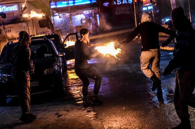 Masked kurdish millitants throw molotov cocktails at a police truck with a water cannon during clashes on August 27,2015 in the Gazi district of Istanbul. Five people, including two children and a soldier, were killed in clashes between Kurdish militants and security forces in Turkey's restive Kurdish-majority southeast on August 27, 2015, local officials and the army said. Masked kurdish millitants throw molotov cocktails at a police truck with a water cannon during clashes on August 27,2015 in the Gazi district of Istanbul. Five people, including two children and a soldier, were killed in clashes between Kurdish militants and security forces in Turkey's restive Kurdish-majority southeast on August 27, 2015, local officials and the army said.