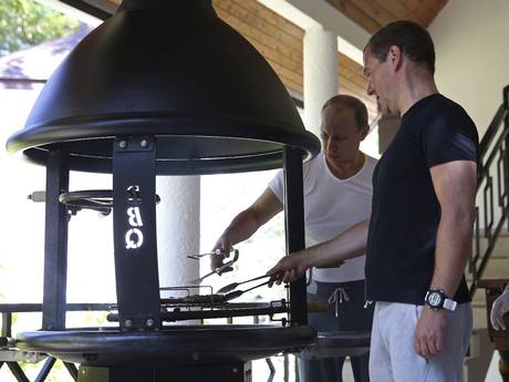 Putin and Medvedev grill meat after their workout Putin and Medvedev grill meat after their workout