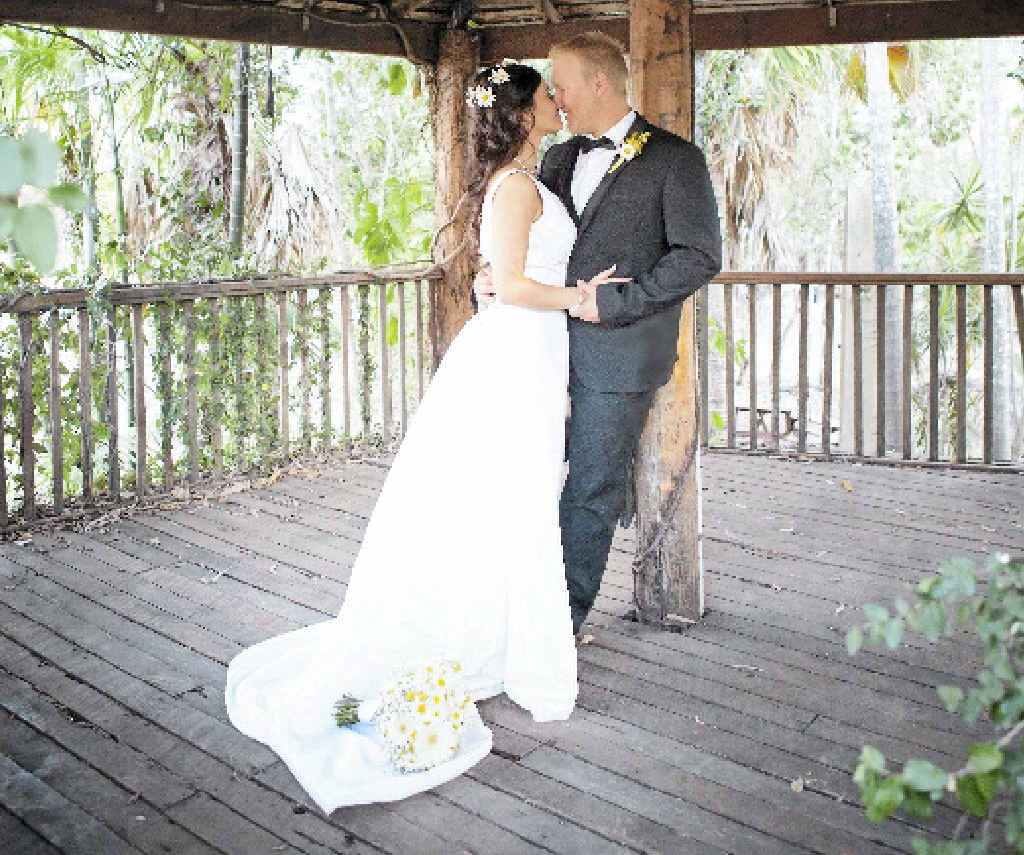 JUST MARRIED: Jessica and Jeremy Dennien share a kiss after their wedding. JUST MARRIED: Jessica and Jeremy Dennien share a kiss after their wedding.