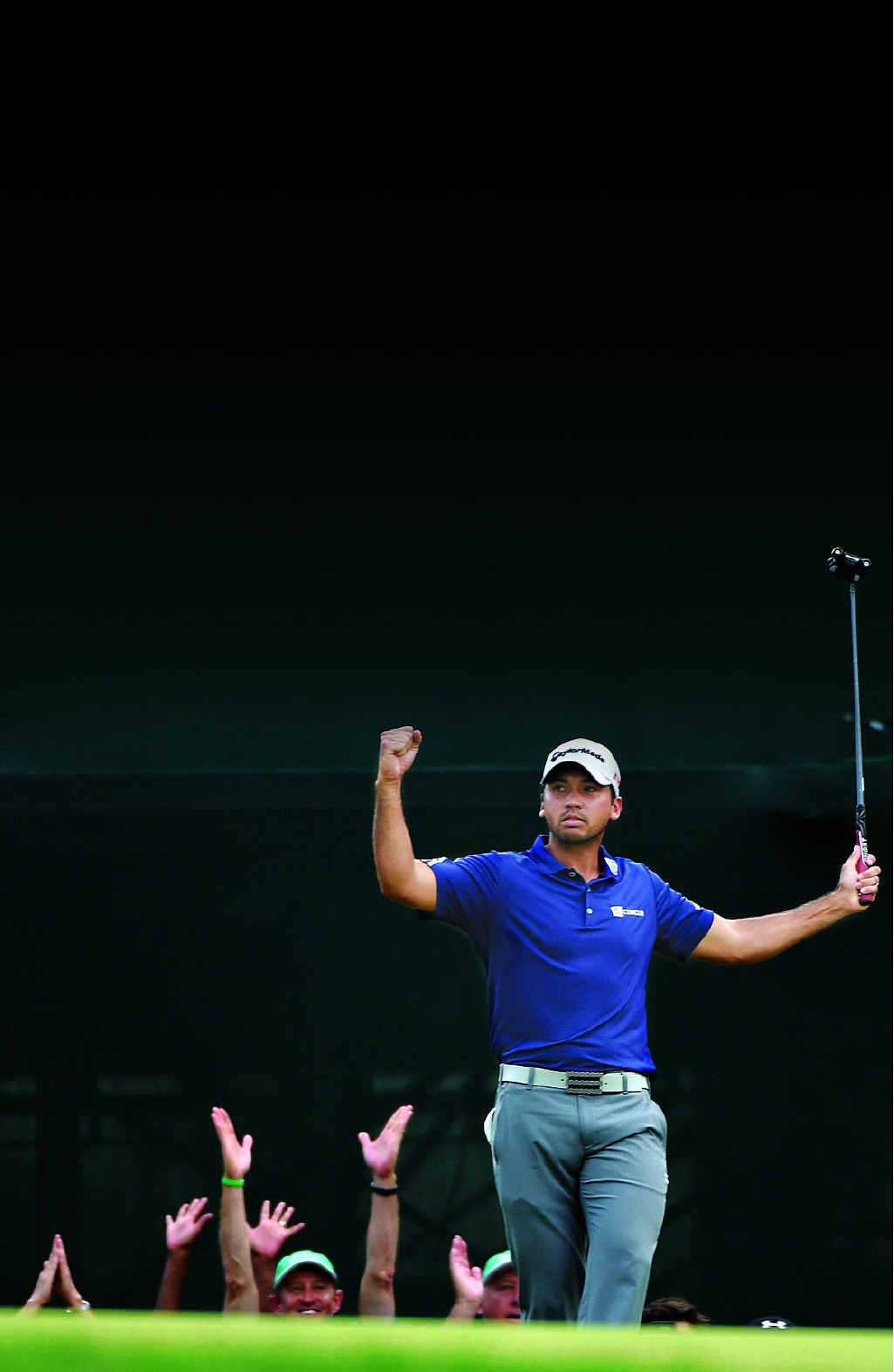 ANOTHER DAY, ANOTHER WIN: Jason Day celebrates on the 18th green after his six-stroke victory at Plainfield Country Club and (inset) with son Dash and wife Ellie. ANOTHER DAY, ANOTHER WIN: Jason Day celebrates on the 18th green after his six-stroke victory at Plainfield Country Club and (inset) with son Dash and wife Ellie.