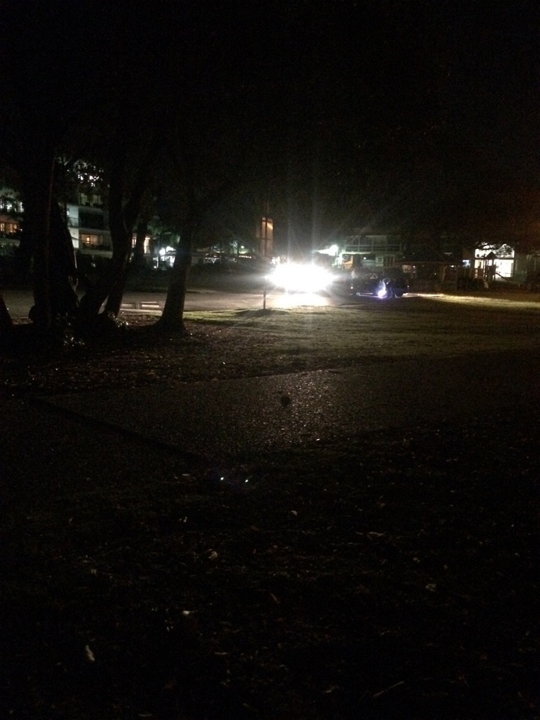 A witness took a photo of last night's Moffat Beach car park scene where an 18-year-old man was allegedly robbed and bashed with a surfboard. PHOTO: Supplied A witness took a photo of last night's Moffat Beach car park scene where an 18-year-old man was allegedly robbed and bashed with a surfboard. PHOTO: Supplied