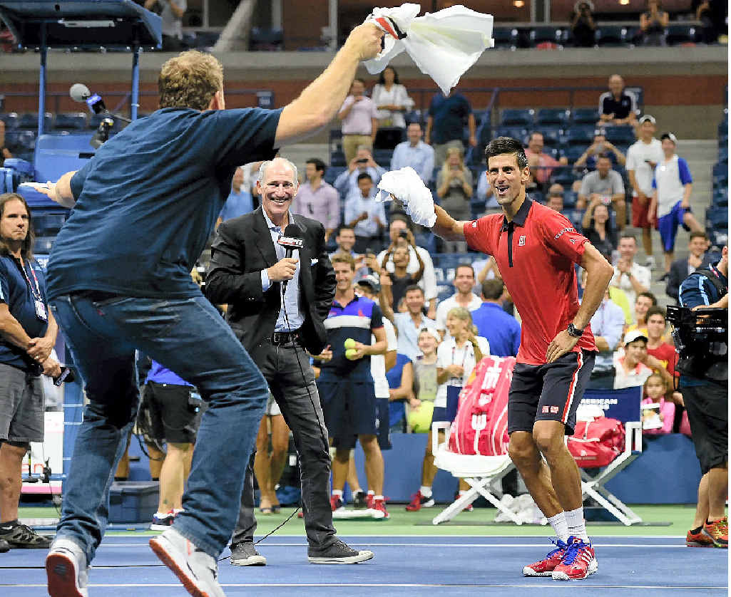 STRUTTING HIS STUFF: Novak Djokovic dances on the court with a fan after defeating Andreas Haider-Maurer of Austria. STRUTTING HIS STUFF: Novak Djokovic dances on the court with a fan after defeating Andreas Haider-Maurer of Austria.