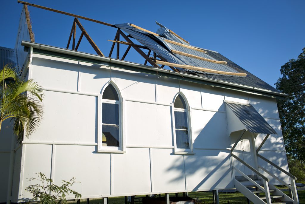 Mount Larcom church battles the odds, neighbours Richard and Mai Pershouse heard the loud banging as the roof tore off the local church when Cyclone Marcia passed through. Photo Paul Braven / The Observer