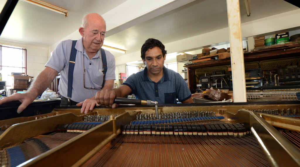 MAKING MUSIC: Piano technician Kevin Kirwin is passing on his knowledge to Myron Doak, who hopes to make a career as a piano tuner technician. MAKING MUSIC: Piano technician Kevin Kirwin is passing on his knowledge to Myron Doak, who hopes to make a career as a piano tuner technician.