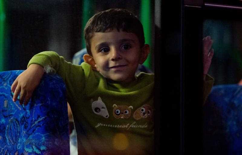 A young boy who recently arrived with other refugees by train sits on a bus at the main train station in Munich, Germany, 06 September 2015. A young boy who recently arrived with other refugees by train sits on a bus at the main train station in Munich, Germany, 06 September 2015.