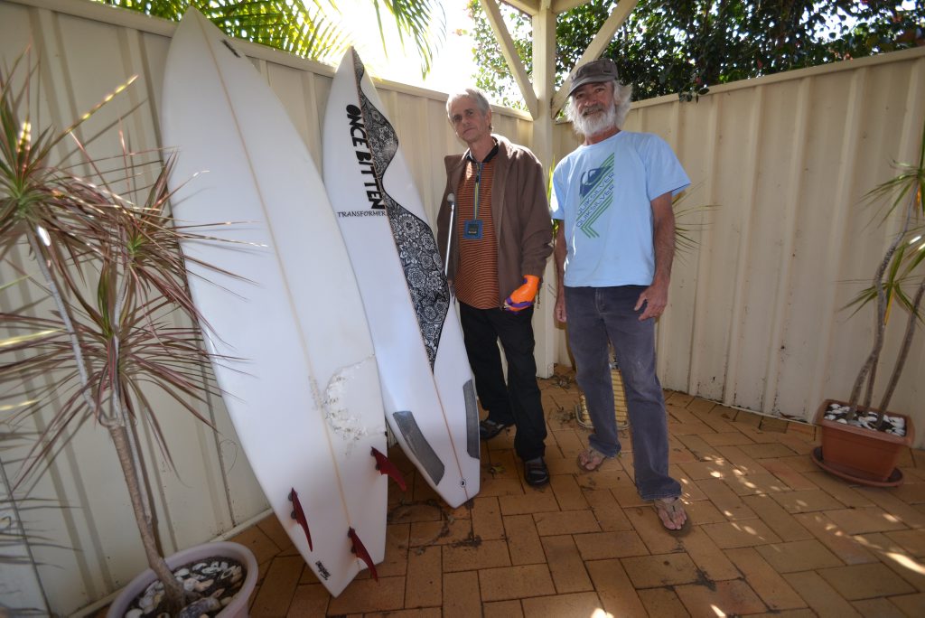 Craig Ison of Evans Head and Darin Reilly of Woodburn with the two boards Mr Reilly has made for Mr Ison. The one on the left has the shark teeth imprint and the other is Mr Ison's new board. Craig Ison of Evans Head and Darin Reilly of Woodburn with the two boards Mr Reilly has made for Mr Ison. The one on the left has the shark teeth imprint and the other is Mr Ison's new board.