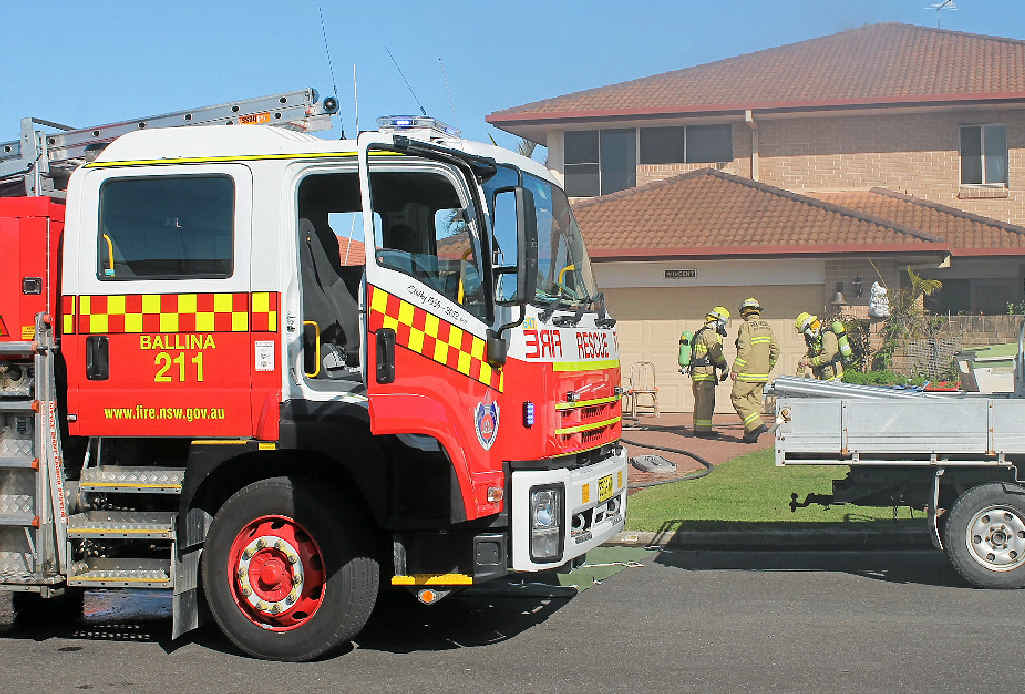 SMOKE HAZARD: Ballina firefighters put on breathing apparatus before entering the Waterview Circuit, West Ballina, where there was a fire on the top floor on September 9. SMOKE HAZARD: Ballina firefighters put on breathing apparatus before entering the Waterview Circuit, West Ballina, where there was a fire on the top floor on September 9.