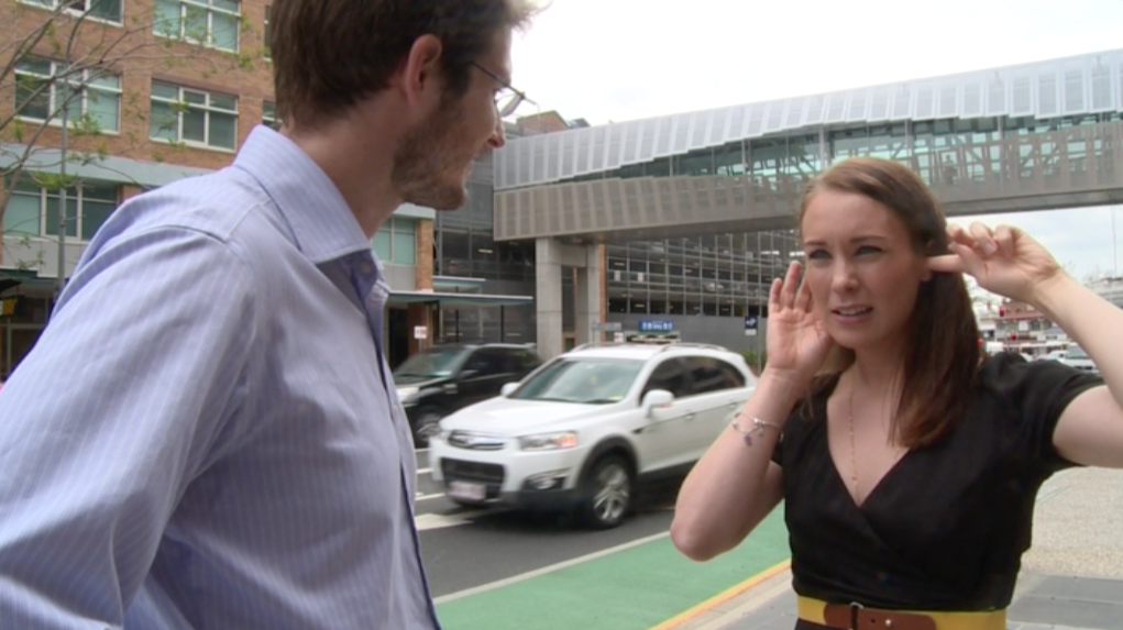 Jennifer experiences the sound of traffic with her cochlear implant for the first time as her husband Dylan looks on. Jennifer experiences the sound of traffic with her cochlear implant for the first time as her husband Dylan looks on.