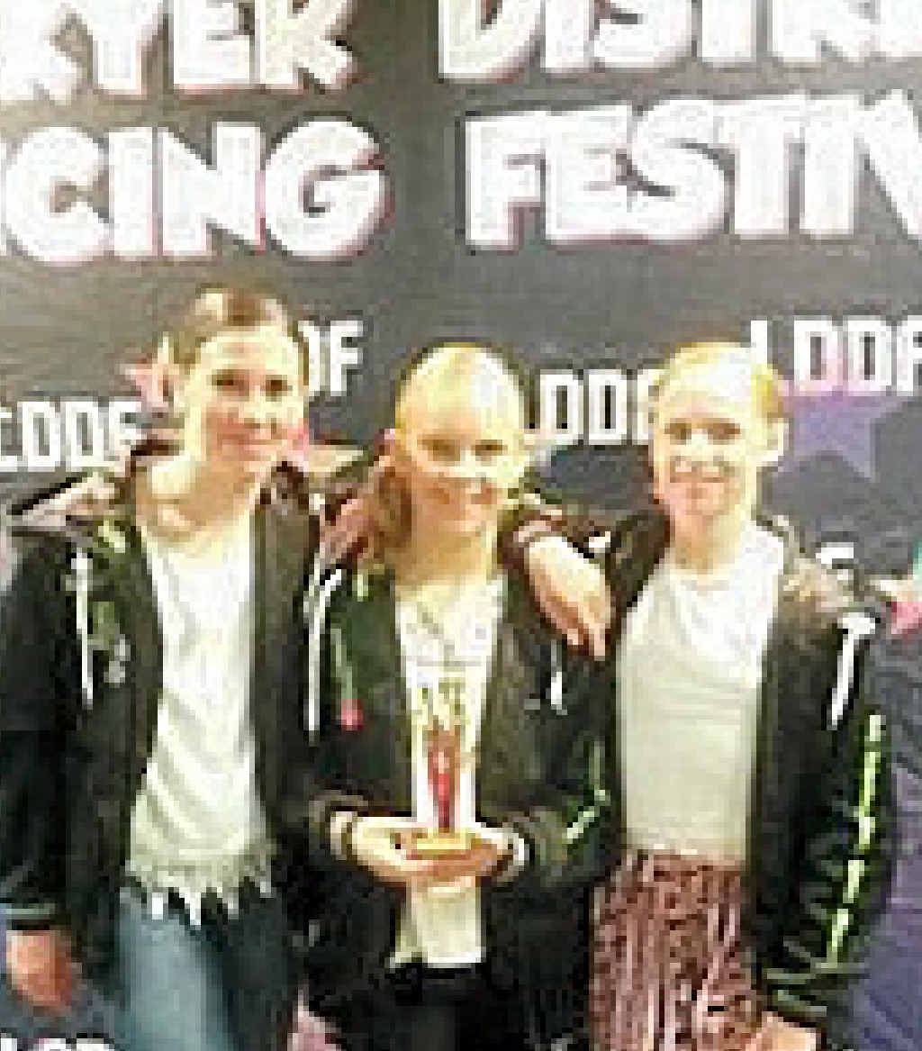 With the trophy for the most promising dance group are Rose Dearden, Hayley Carey and Faith Kelly.