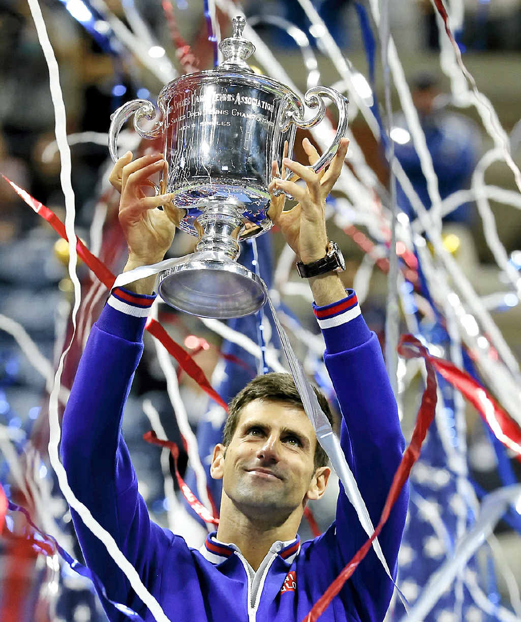NEW YORK STATE OF MIND: Novak Djokovic holds up the championship trophy after defeating Roger Federer in the US Open final. NEW YORK STATE OF MIND: Novak Djokovic holds up the championship trophy after defeating Roger Federer in the US Open final.