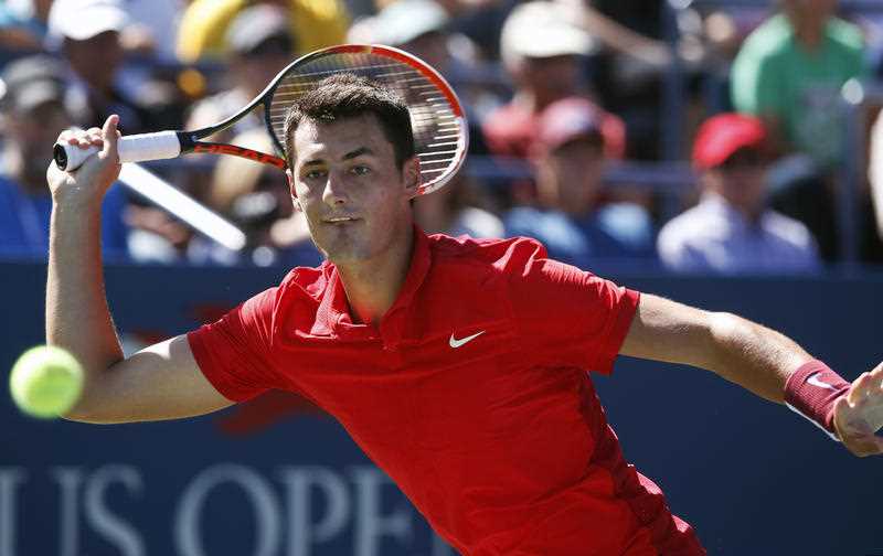 Bernard Tomic, of Australia, returns a shot to Richard Gasquet, of France, during the third round of the U.S. Open tennis tournament, Saturday, Sept. 5, 2015, in New York. Bernard Tomic, of Australia, returns a shot to Richard Gasquet, of France, during the third round of the U.S. Open tennis tournament, Saturday, Sept. 5, 2015, in New York.