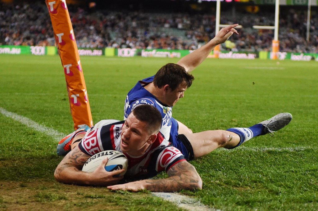 Shaun Kenny-Dowall of the Roosters scores the opening try during the first NRL Semi Final between the Sydney Roosters and the Canterbury-Bankstown Bulldogs at Allianz Stadium in Sydney, Friday, Sept. 18, 2015. (AAP Image/Dean Lewins) NO ARCHIVING, EDITORIAL USE ONLY Shaun Kenny-Dowall of the Roosters scores the opening try during the first NRL Semi Final between the Sydney Roosters and the Canterbury-Bankstown Bulldogs at Allianz Stadium in Sydney, Friday, Sept. 18, 2015. (AAP Image/Dean Lewins) NO ARCHIVING, EDITORIAL USE ONLY