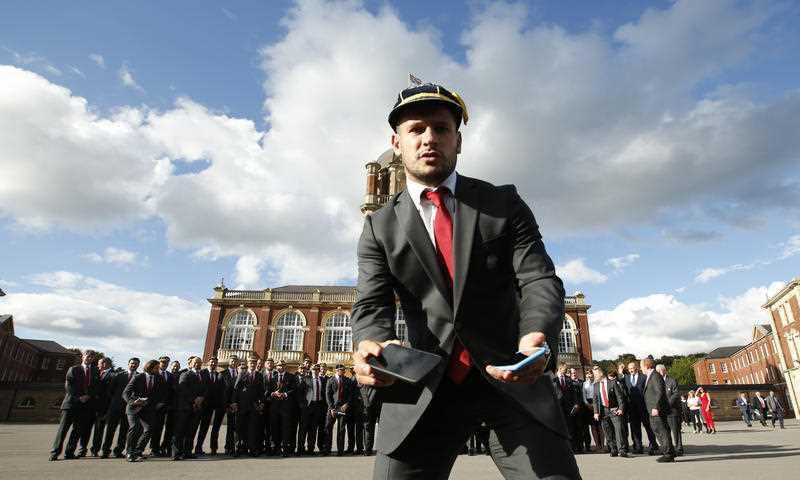 England's Danny Care holds out two smart phones and asks the media to take a picture of the team group following the welcome ceremony for the Rugby World Cup at the Royal Militay Academy at Sandhurst, England Saturday, Sept. 12, 2015. The RWC starts Friday, Sept. 18, with England playing Fiji, and ends with the final on Oct 31. England's Danny Care holds out two smart phones and asks the media to take a picture of the team group following the welcome ceremony for the Rugby World Cup at the Royal Militay Academy at Sandhurst, England Saturday, Sept. 12, 2015. The RWC starts Friday, Sept. 18, with England playing Fiji, and ends with the final on Oct 31.