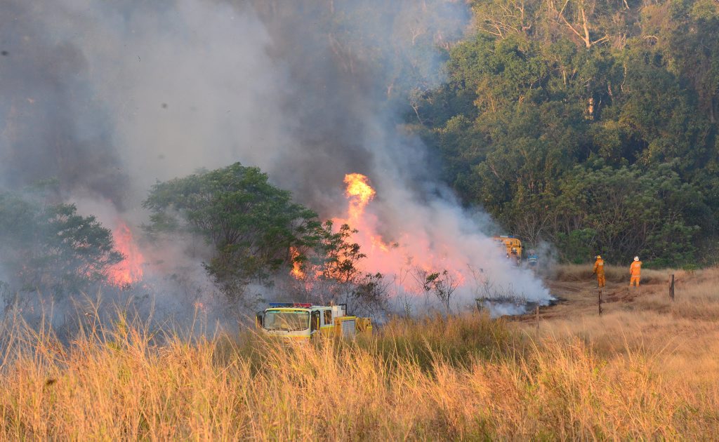 The Caves Rural Fire Service battles a bushfire off Camoo Caves Rd which was threatening houses Photo Rachael Conaghan/The Morning Bulletin The Caves Rural Fire Service battles a bushfire off Camoo Caves Rd which was threatening houses Photo Rachael Conaghan/The Morning Bulletin