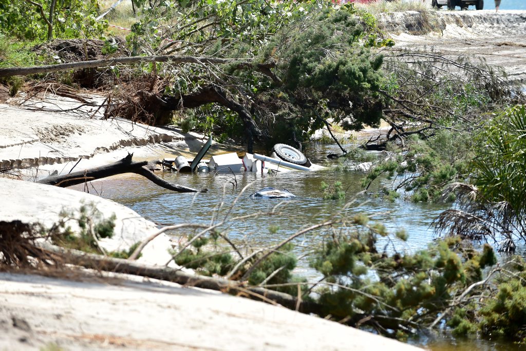 A large sink hole has swallowed a large chunk of the camping area on Inskip Point, taking with it a caravan, camper trailer and one vehicle. Photo: Che Chapman / Sunshine Coast Daily A large sink hole has swallowed a large chunk of the camping area on Inskip Point, taking with it a caravan, camper trailer and one vehicle. Photo: Che Chapman / Sunshine Coast Daily