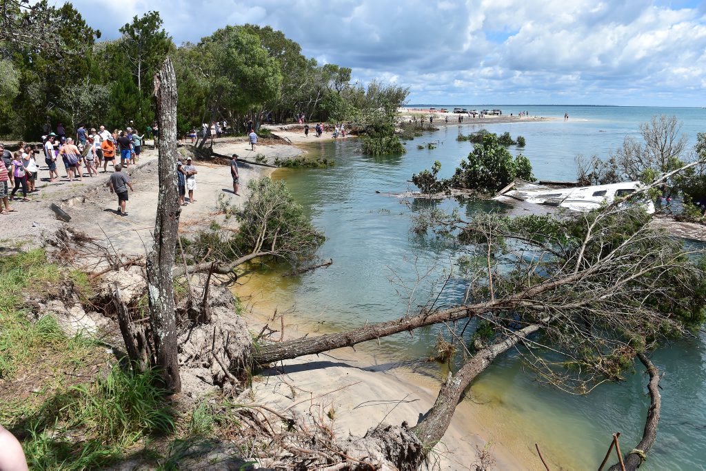 A large sink hole has swallowed a large chunk of the camping area on Inskip Point, taking with it a caravan, camper trailer and one vehicle. Photo: Che Chapman / Sunshine Coast Daily A large sink hole has swallowed a large chunk of the camping area on Inskip Point, taking with it a caravan, camper trailer and one vehicle. Photo: Che Chapman / Sunshine Coast Daily