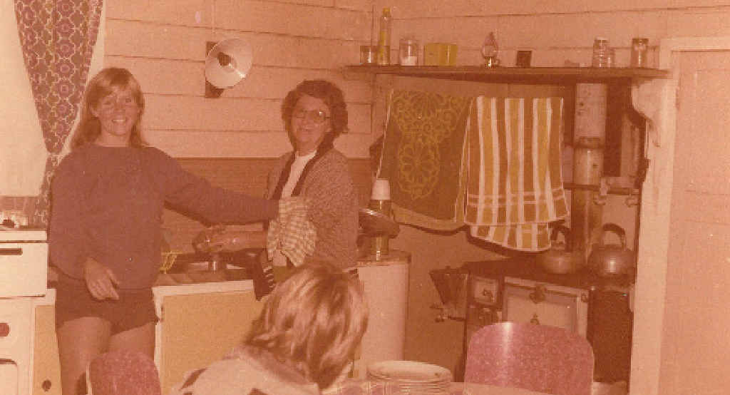 BEACH SHACK: Jenny with Elaine in the kitchen. Note the water fountain on side of stove. BEACH SHACK: Jenny with Elaine in the kitchen. Note the water fountain on side of stove.
