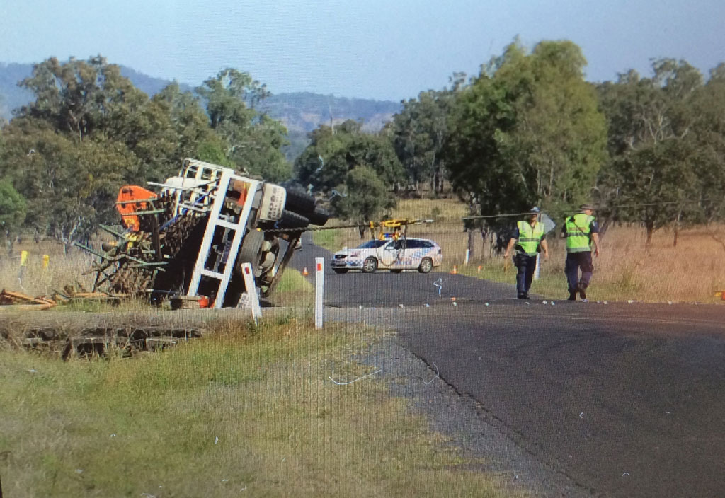 Police from the Forensic Crash Unit at the scene of a fatal traffic collision at Peak Crossing on Thursday morning. Police from the Forensic Crash Unit at the scene of a fatal traffic collision at Peak Crossing on Thursday morning.