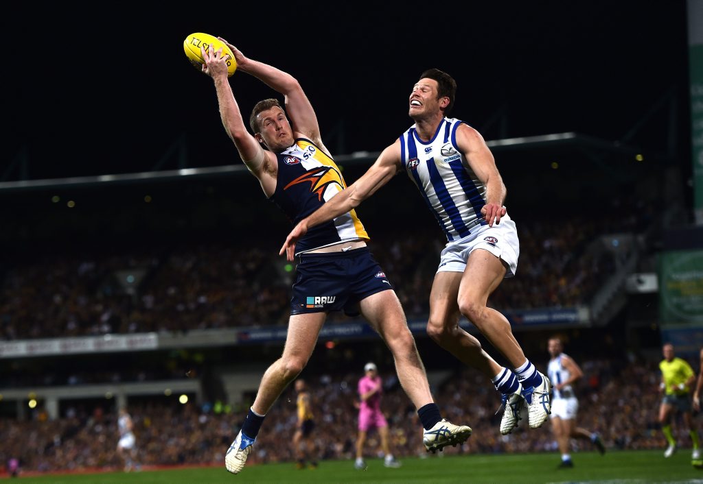 West Coast Eagles player Xavier Ellis (left) marks against the North Melbourne Kangaroos during the second preliminary final of the AFL at Domain Stadium in Perth, Saturday, Sept. 26, 2015. (AAP Image/Julian Smith) NO ARCHIVING, EDITORIAL USE ONLY West Coast Eagles player Xavier Ellis (left) marks against the North Melbourne Kangaroos during the second preliminary final of the AFL at Domain Stadium in Perth, Saturday, Sept. 26, 2015. (AAP Image/Julian Smith) NO ARCHIVING, EDITORIAL USE ONLY