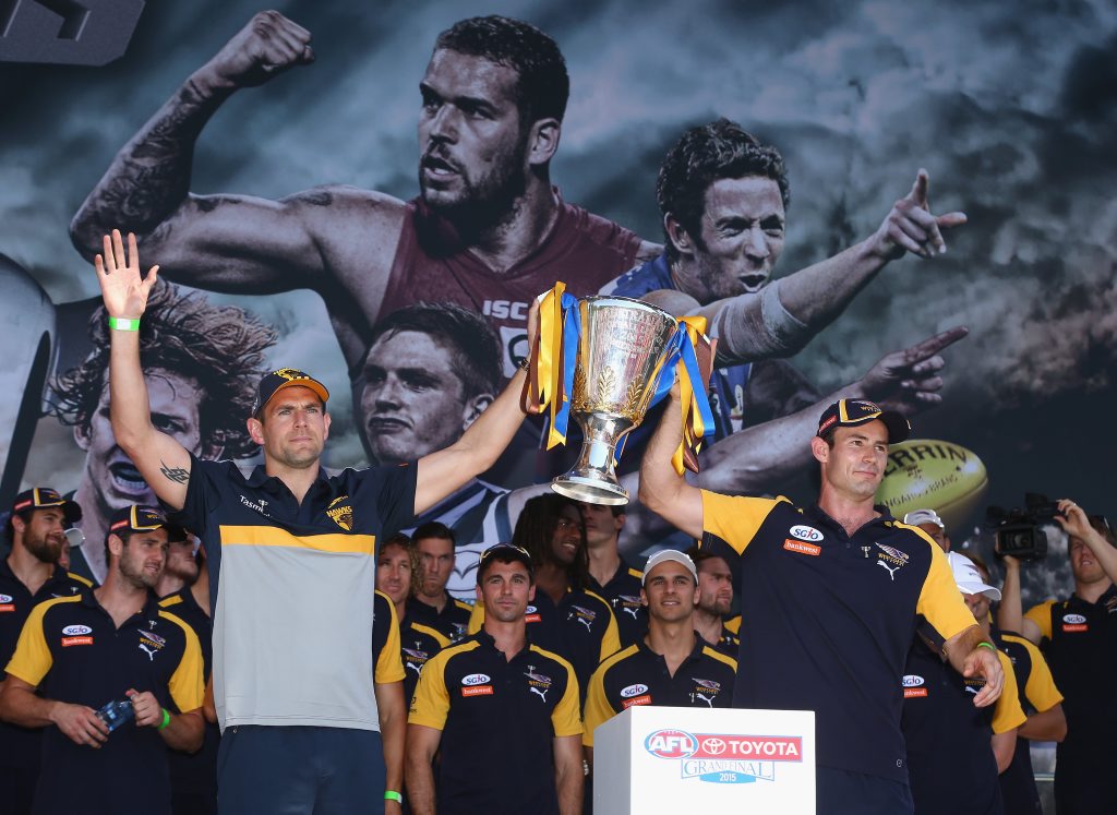 MELBOURNE, AUSTRALIA - OCTOBER 02: Hawks captain Luke Hodge and Eagles captain Shannon Hurn hold aloft the Grand Final Trophy during the 2015 AFL Grand Final parade on October 2, 2015 in Melbourne, Australia. (Photo by Robert Cianflone/Getty Images) MELBOURNE, AUSTRALIA - OCTOBER 02: Hawks captain Luke Hodge and Eagles captain Shannon Hurn hold aloft the Grand Final Trophy during the 2015 AFL Grand Final parade on October 2, 2015 in Melbourne, Australia. (Photo by Robert Cianflone/Getty Images)