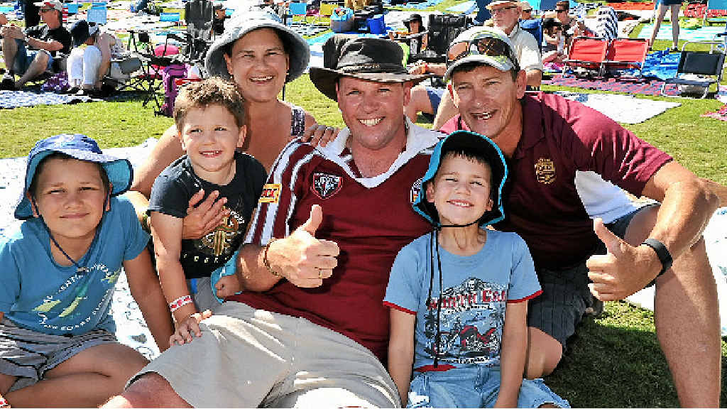 BEST OF BOTH WORLDS: Combining music and football fever for the Truman family, from Elimbah, are from left Joe, 7, Nic, 3, Kath, Dave and Ben, 5, with friend Stevo O’Neill, from North Lakes. BEST OF BOTH WORLDS: Combining music and football fever for the Truman family, from Elimbah, are from left Joe, 7, Nic, 3, Kath, Dave and Ben, 5, with friend Stevo O’Neill, from North Lakes.