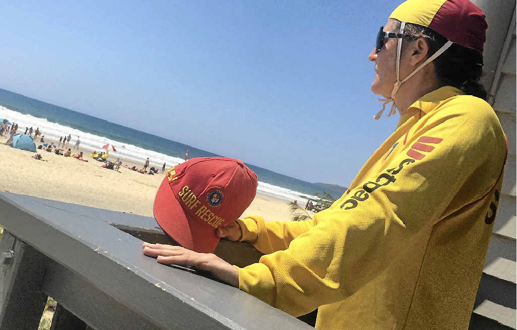 ON WATCH: Rainbow Beach Surf Life Saving Club secretary Melissa Dennien keeps watch over the Rainbow Beach crowd yesterday. ON WATCH: Rainbow Beach Surf Life Saving Club secretary Melissa Dennien keeps watch over the Rainbow Beach crowd yesterday.