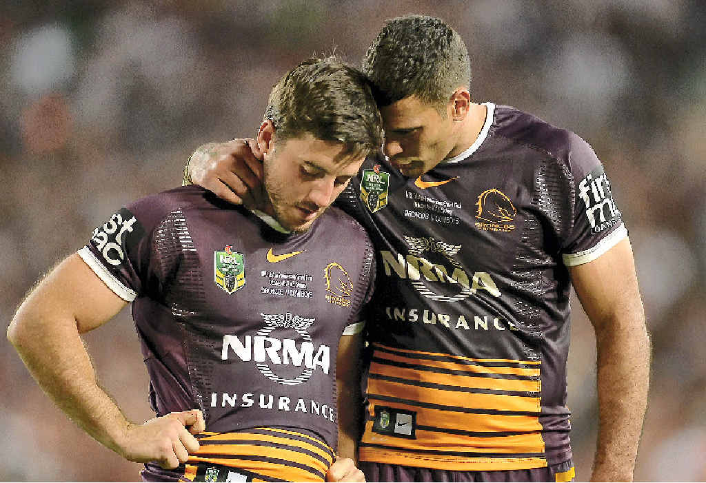 CONSOLING CAPTAIN: Broncos skipper Justin Hodges puts an arm round Ben Hunt (left) after the NRL grand final loss. CONSOLING CAPTAIN: Broncos skipper Justin Hodges puts an arm round Ben Hunt (left) after the NRL grand final loss.