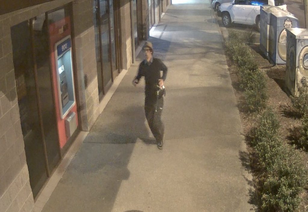 Police believe the man pictured in these CCTV images may be able to assist with their inquiries about two armed robberies in Byron Bay last month. Photo Contributed Police believe the man pictured in these CCTV images may be able to assist with their inquiries about two armed robberies in Byron Bay last month. Photo Contributed