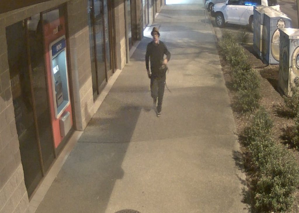 Police believe the man pictured in these CCTV images may be able to assist with their inquiries about two armed robberies in Byron Bay last month. Photo Contributed Police believe the man pictured in these CCTV images may be able to assist with their inquiries about two armed robberies in Byron Bay last month. Photo Contributed