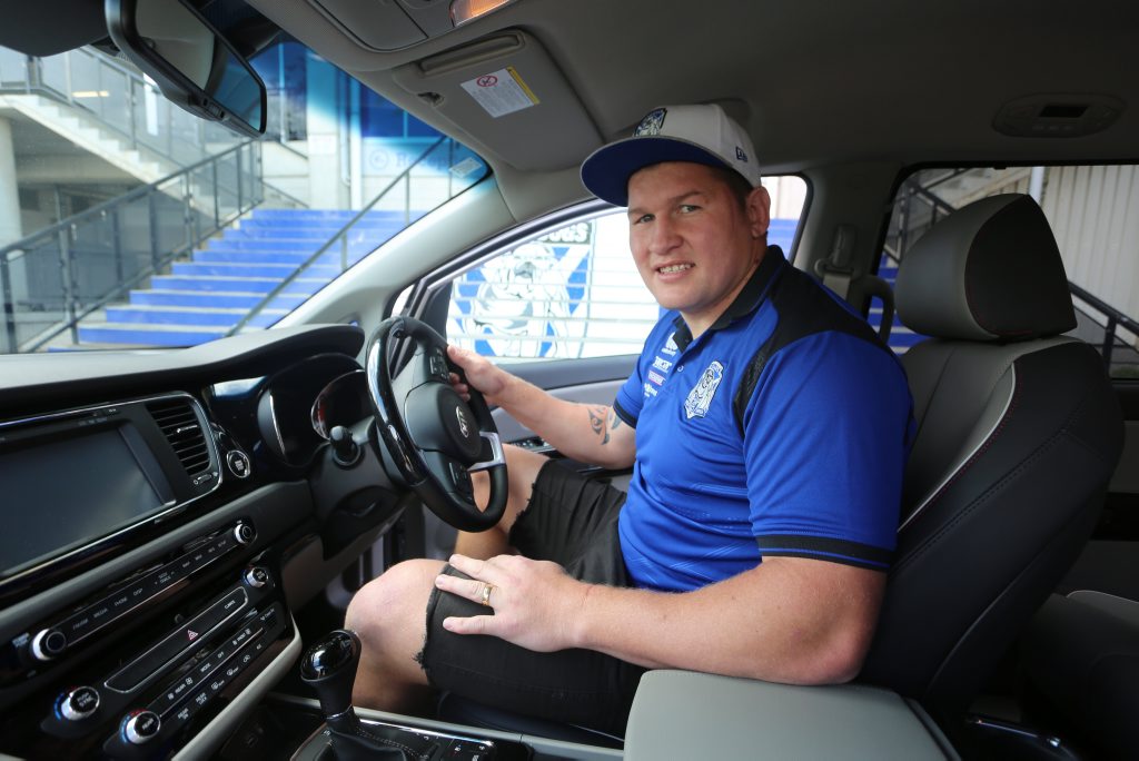 FOUR KIDS IN THE BACK: Kia Carnival a fine family bus for NRL player Greg Eastwood. FOUR KIDS IN THE BACK: Kia Carnival a fine family bus for NRL player Greg Eastwood.