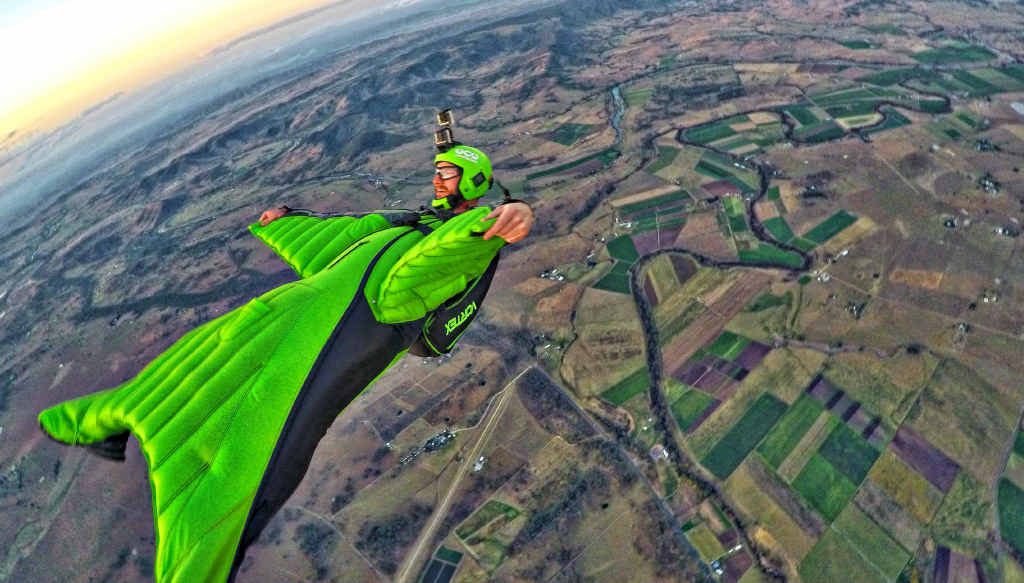 CRUISING ALTITUDE: Wingsuit pilot Chris Byrnes enjoys a sunset glide over Toogoolawah. CRUISING ALTITUDE: Wingsuit pilot Chris Byrnes enjoys a sunset glide over Toogoolawah.