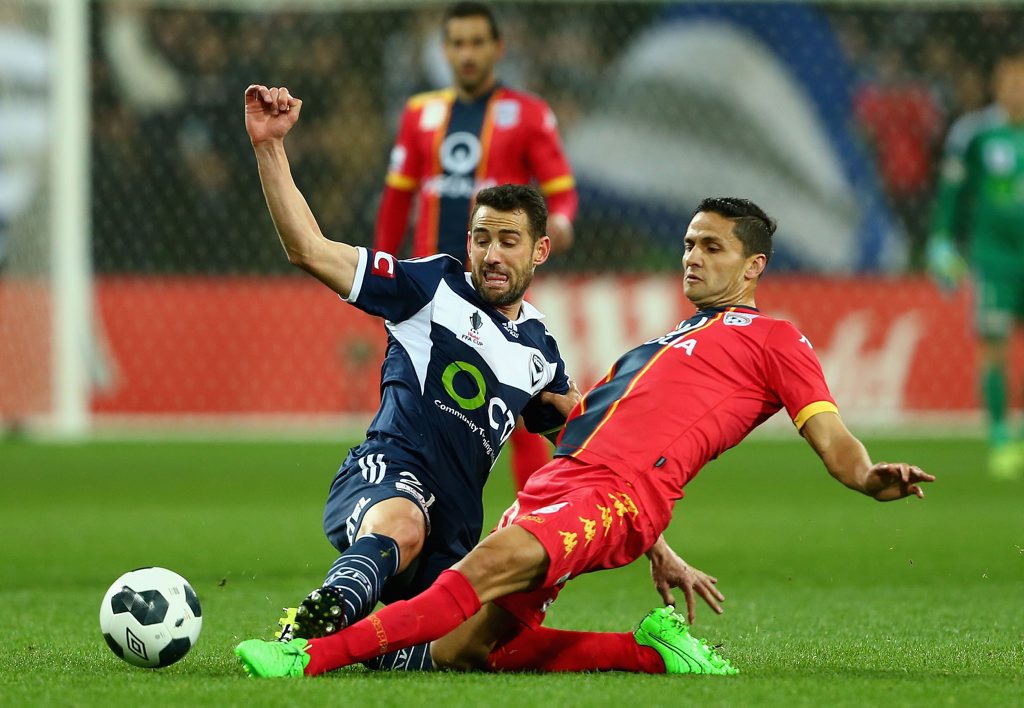 MELBOURNE, AUSTRALIA - SEPTEMBER 22: Carl Valeri of Victory and Osama Malik of Adelaide contest the ball during the FFA Cup Quarter Final match between the Melbourne Victory and Adelaide United at AAMI Park on September 22, 2015 in Melbourne, Australia. (Photo by Robert Prezioso/Getty Images) MELBOURNE, AUSTRALIA - SEPTEMBER 22: Carl Valeri of Victory and Osama Malik of Adelaide contest the ball during the FFA Cup Quarter Final match between the Melbourne Victory and Adelaide United at AAMI Park on September 22, 2015 in Melbourne, Australia. (Photo by Robert Prezioso/Getty Images)