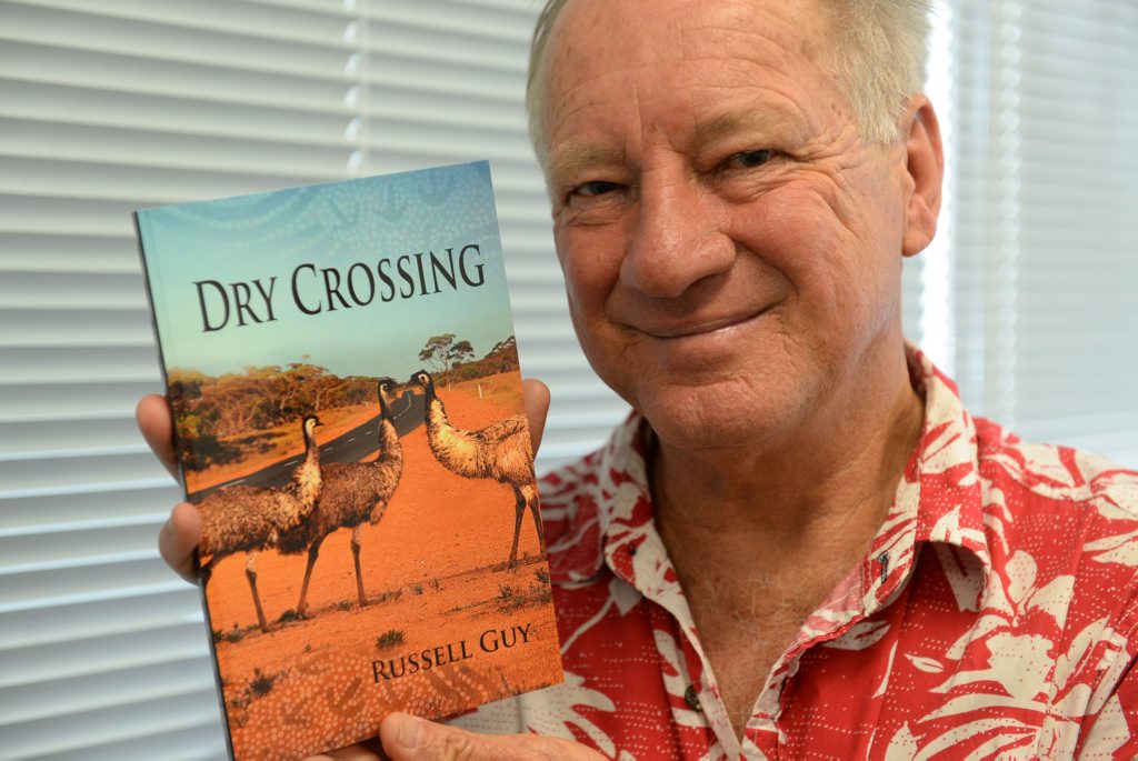 CONTEMPORARY FICTION: Agnes Water author Russell Guy with his novel Dry Crossing. Photo: Mike Knott / NewsMail CONTEMPORARY FICTION: Agnes Water author Russell Guy with his novel Dry Crossing. Photo: Mike Knott / NewsMail