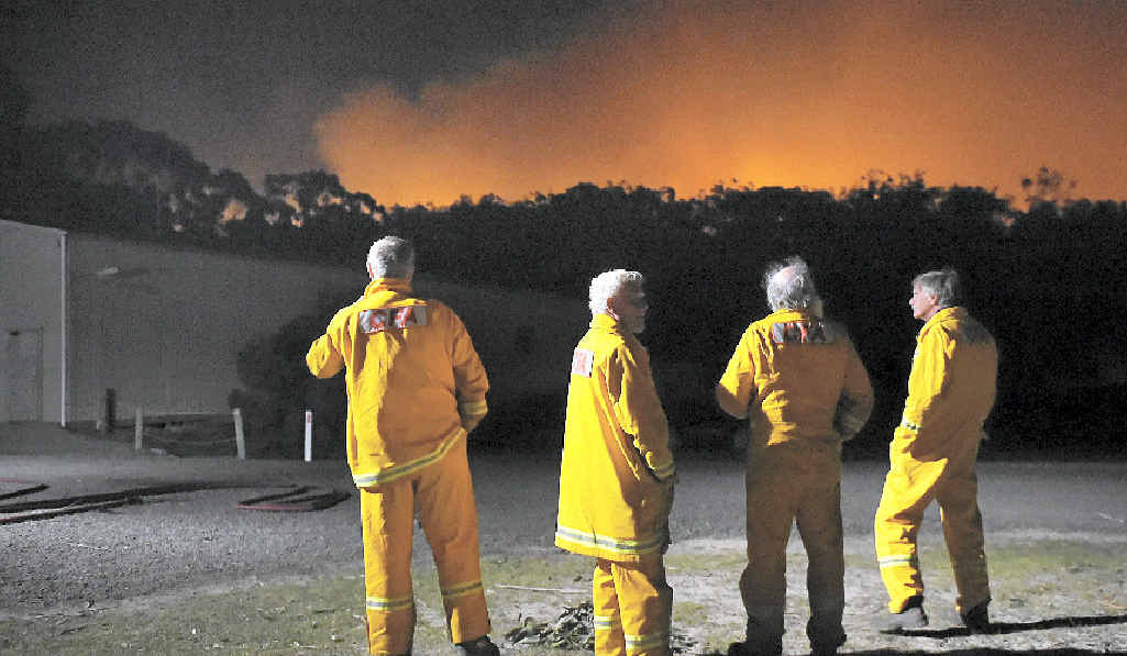 HEATING UP: CFA firefighters take a short break and watch a spot fire near Benloch, Victoria, this week. HEATING UP: CFA firefighters take a short break and watch a spot fire near Benloch, Victoria, this week.