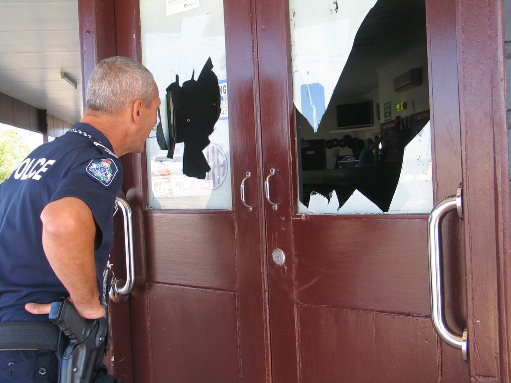 SMASHING TIME: Senior Constable Wright of Maryborough Scenes of Crime checks out the overnight damage at Commercial Hotel at Biggenden. Photo Erica Murree / Central & North Burnett Times SMASHING TIME: Senior Constable Wright of Maryborough Scenes of Crime checks out the overnight damage at Commercial Hotel at Biggenden. Photo Erica Murree / Central & North Burnett Times