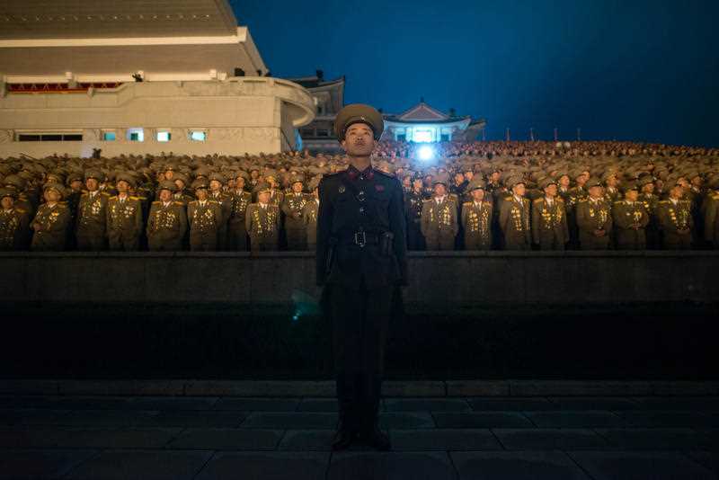 A North Korean soldier stands before spectators during a torch-light performance in Pyongyang on October 10, 2015. North Korea was marking the 70th anniversary of its ruling Workers' Party. A North Korean soldier stands before spectators during a torch-light performance in Pyongyang on October 10, 2015. North Korea was marking the 70th anniversary of its ruling Workers' Party.