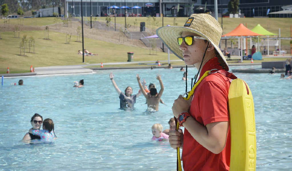 VIGILANT: Lifeguard Gareth Mills keeps an eye on swimmers at Orion Lagoon yesterday. VIGILANT: Lifeguard Gareth Mills keeps an eye on swimmers at Orion Lagoon yesterday.