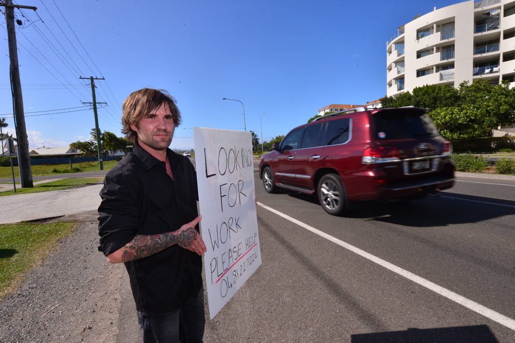 Daniel is looking for a job and was seen holding this sign in Marcoola. Photo: John McCutcheon / Sunshine Coast Daily Daniel is looking for a job and was seen holding this sign in Marcoola. Photo: John McCutcheon / Sunshine Coast Daily