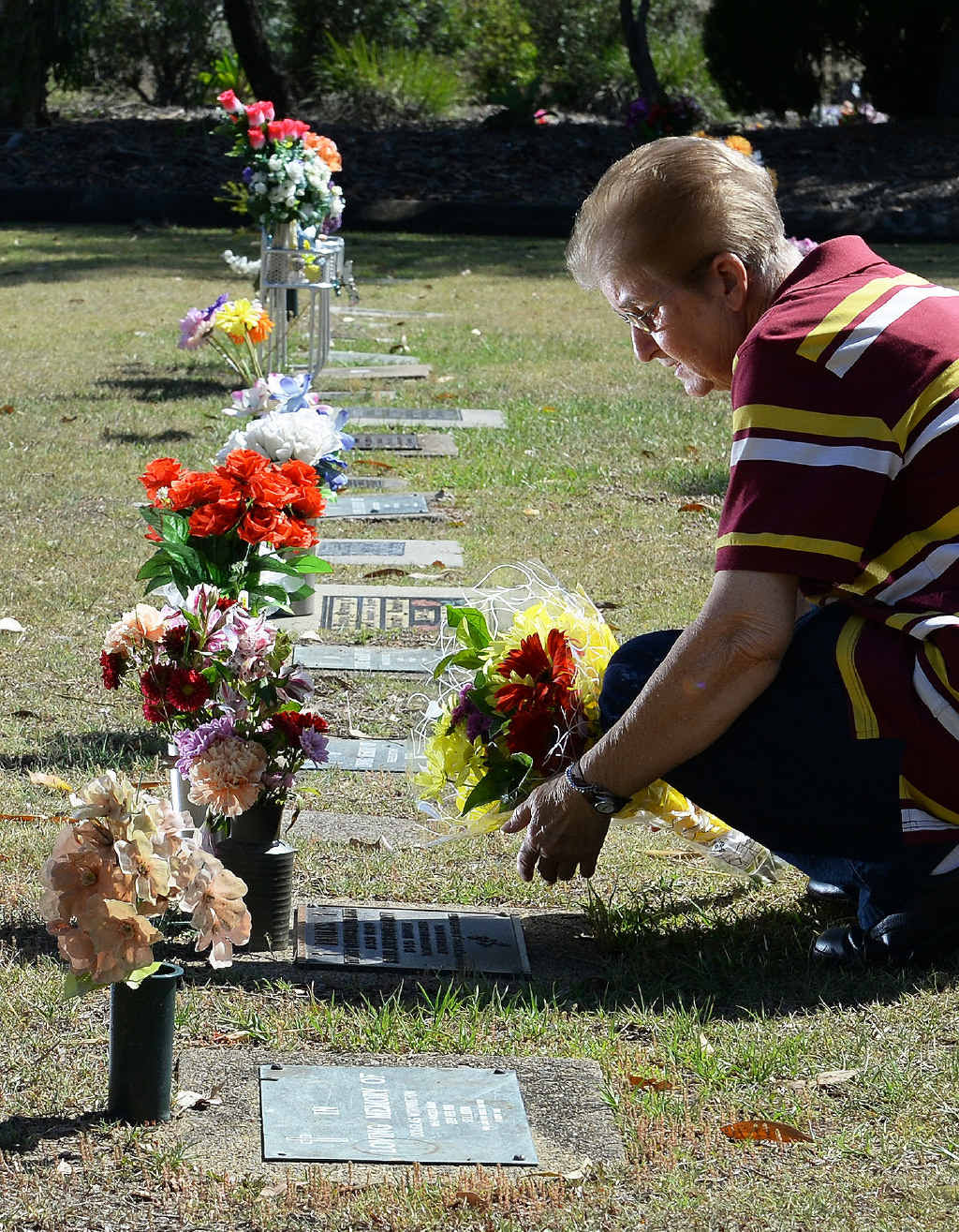 RAW EMOTION: Joy Faulks placing flowers at her children’s grave sites. RAW EMOTION: Joy Faulks placing flowers at her children’s grave sites.