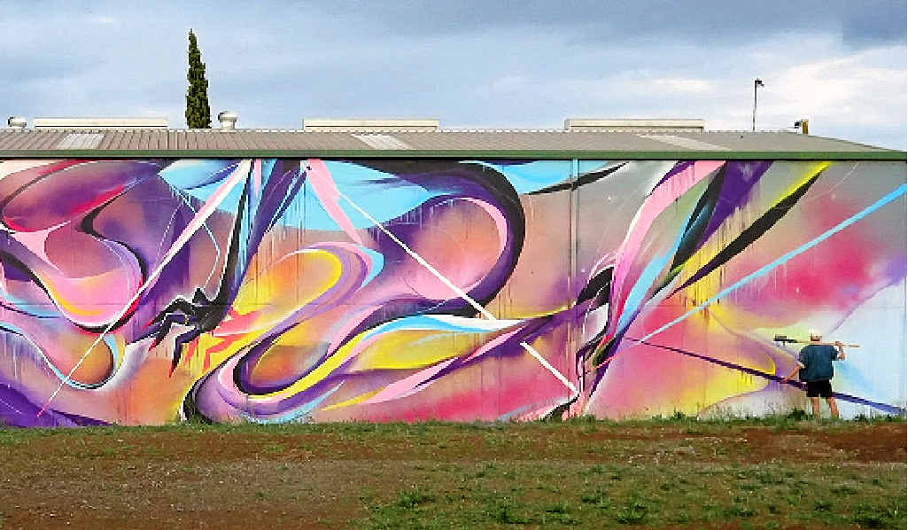 STYLE: Mik Shida, seen here finishing the Mort St mural, is a heavyweight of Australia’s burgeoning street art scene. STYLE: Mik Shida, seen here finishing the Mort St mural, is a heavyweight of Australia’s burgeoning street art scene.
