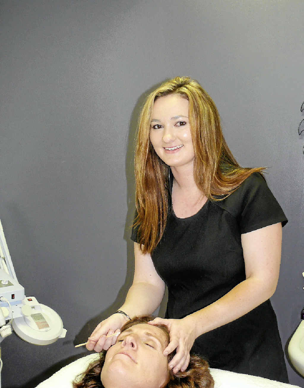 Grafton beautician Jessica Hicks touches up the eyebrows of work colleague Renai Cravigan at their business in Queen St. Jess has just completed her first round of a new treatment for multiple sclerosis called Lemtrada. PHOTO: TIM HOWARD Grafton beautician Jessica Hicks touches up the eyebrows of work colleague Renai Cravigan at their business in Queen St. Jess has just completed her first round of a new treatment for multiple sclerosis called Lemtrada. PHOTO: TIM HOWARD
