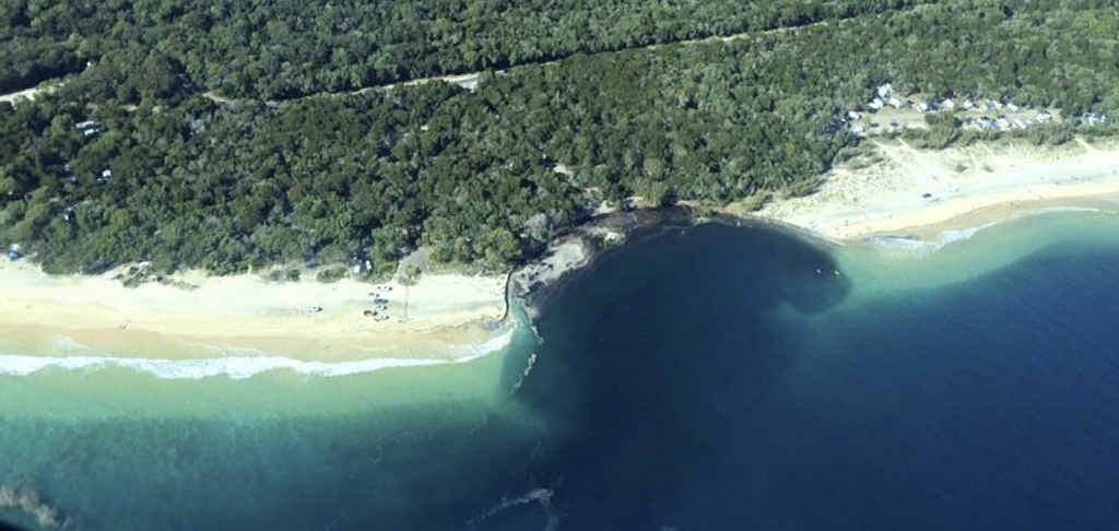 GIANT BITE: The 150-metre long and 50-metre wide chasm which opened up at at Inskip Point last month. GIANT BITE: The 150-metre long and 50-metre wide chasm which opened up at at Inskip Point last month.