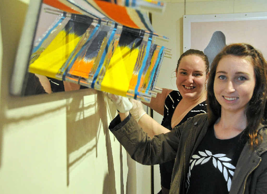 GO TIME: Erin Gale and Exhibitions & Education officer Sarah Robertson, during the installation of the 2015 Rio Tinto Martin Hanson Memorial Art Awards. GO TIME: Erin Gale and Exhibitions & Education officer Sarah Robertson, during the installation of the 2015 Rio Tinto Martin Hanson Memorial Art Awards.