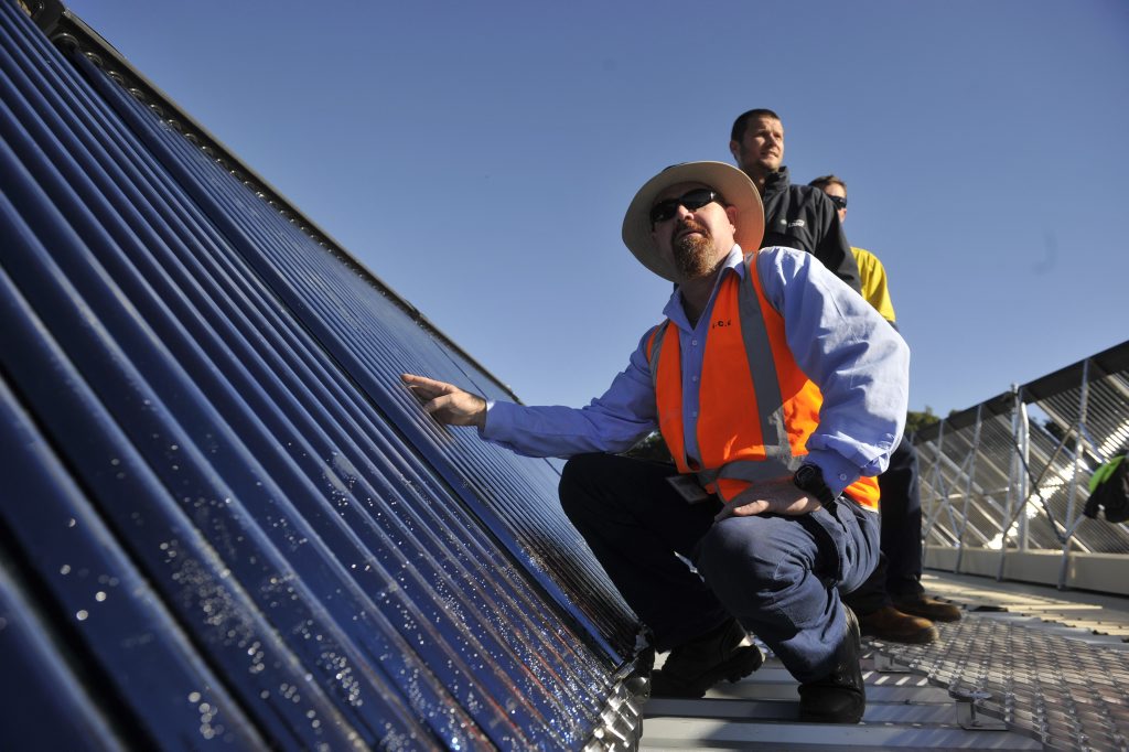(From left) Lismore City Coucncillor Steve Dillon, Laser Plumbing construction manager Jake Campbell, and Laser Plumbing Site Supervision Brett Eaglesham on the roof of the Memorial Baths where the new solar water system has been installed. Photo Marc Stapelberg / The Northern Star (From left) Lismore City Coucncillor Steve Dillon, Laser Plumbing construction manager Jake Campbell, and Laser Plumbing Site Supervision Brett Eaglesham on the roof of the Memorial Baths where the new solar water system has been installed. Photo Marc Stapelberg / The Northern Star