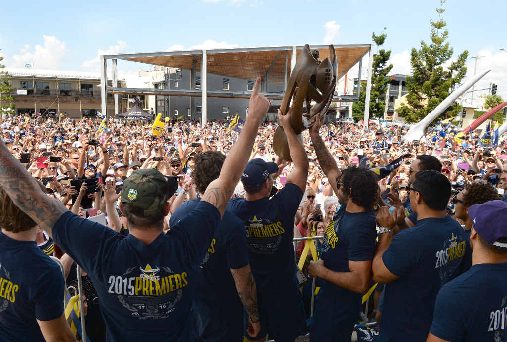 THE COWBOYS ARE MY TEAM: The North Queensland Cowboys including Johnathan Thurston and Matt Scott show off the premiership trophy to Mackay fans at a packed Bluewater Quay yesterday. THE COWBOYS ARE MY TEAM: The North Queensland Cowboys including Johnathan Thurston and Matt Scott show off the premiership trophy to Mackay fans at a packed Bluewater Quay yesterday.