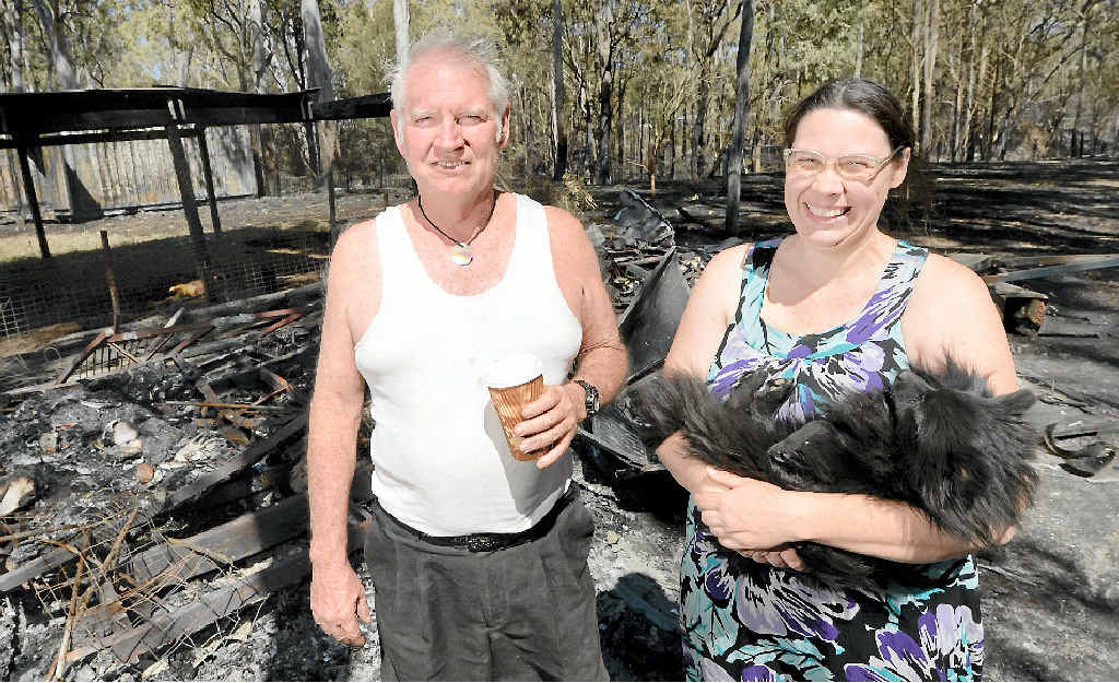 RELIEVED: Despite losing a caravan and the contents of a shipping container to fire, Ross Allan and his daughter Aleisa were happy that they did not lose their home or their pet dogs during a bushfire in the Struck Oil area last year. RELIEVED: Despite losing a caravan and the contents of a shipping container to fire, Ross Allan and his daughter Aleisa were happy that they did not lose their home or their pet dogs during a bushfire in the Struck Oil area last year.
