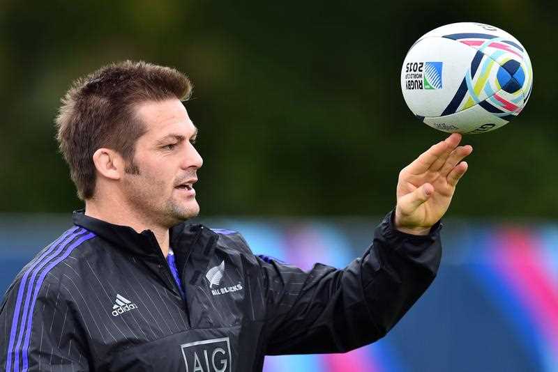 New Zealand All Blacks' flanker and captain Richie McCaw plays with the ball during a training session at the Lensbury Hotel in Teddington, south-west London, on September 16, 2015, ahead of the 2015 Rugby Union World Cup, which begins on September 18. New Zealand All Blacks' flanker and captain Richie McCaw plays with the ball during a training session at the Lensbury Hotel in Teddington, south-west London, on September 16, 2015, ahead of the 2015 Rugby Union World Cup, which begins on September 18.