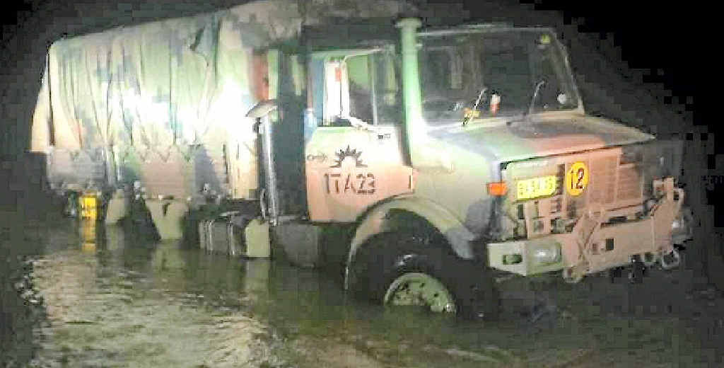 STUCK: Night falls on the bogged Unimog at Double Island Point. It was towed out the following morning at low tide. STUCK: Night falls on the bogged Unimog at Double Island Point. It was towed out the following morning at low tide.